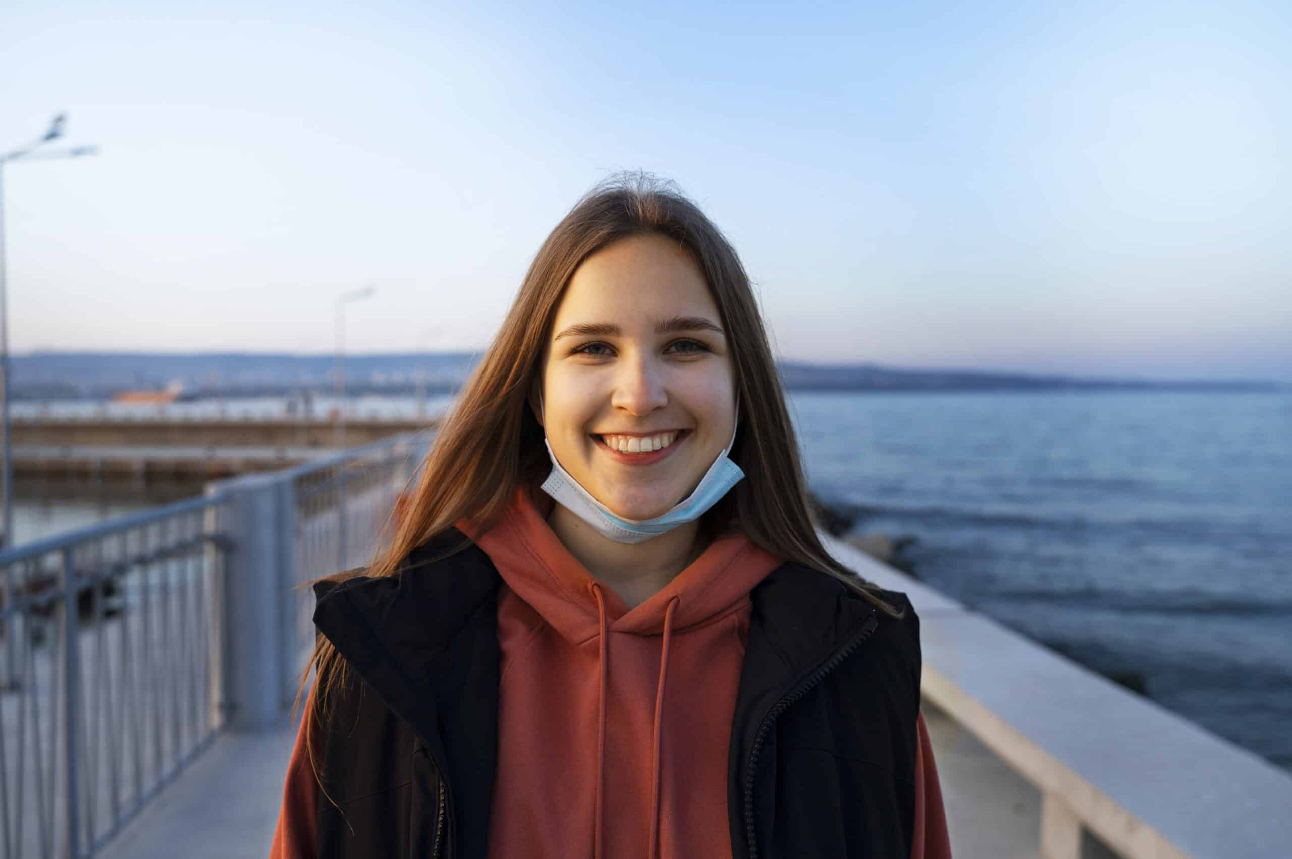 Front view smiley woman seaside